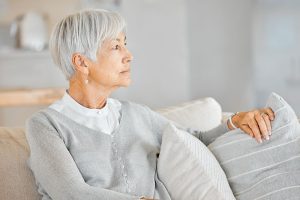 Shot of a senior woman looking thoughtful at home.